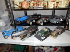 4 x radios in form of vintage cars and 6 model cars in varying conditions by Burago etc.