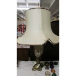 A heavy gilt brass and marble table lamp with shade (shade a/f).
