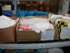 4 boxes of assorted linen, lace etc.