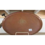A large oval arts and crafts tray by Hugh Wallis (signed) circa 1900. 55.5 x 39 cm.