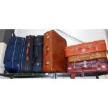 7 various suitcases