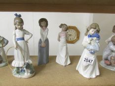 4 NAO by Lladro girl figurines.