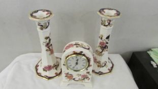 A Mason's Mandalay pattern clock together with a pair of Mason's Blue Mandalay pattern candlesticks.