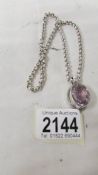 A heavy quality silver belcher chain and amethyst set pendant (all silver).