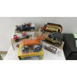 A collection of boxed tin plate cars and toys.