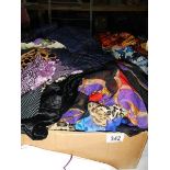 A large quantity of silk and other scarves.