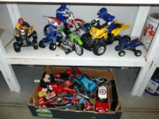 2 shelves of toys including motorcycles, quad bikes etc.