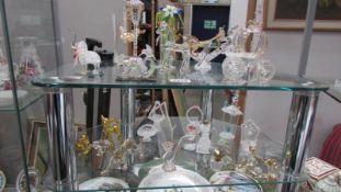 A good lot of tourist ware glass animals etc., some with rough edges.