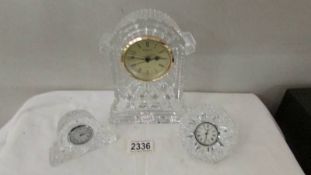 Three Waterford crystal clocks.