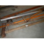 A quantity of G clamps and garden tools.
