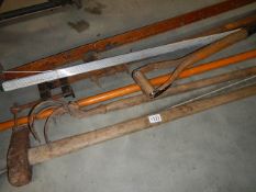 A quantity of G clamps and garden tools.