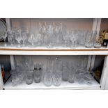 2 shelves of crystal and other glasses in sets of 4's and 2's etc.