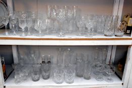 2 shelves of crystal and other glasses in sets of 4's and 2's etc.