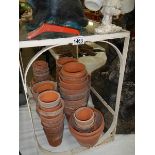 A quantity of terracotta plant pots.