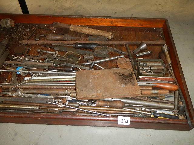 An old tray of metal rods etc.