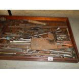 An old tray of metal rods etc.