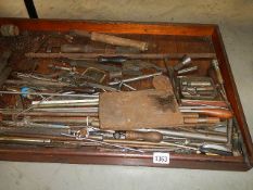 An old tray of metal rods etc.
