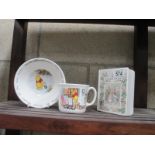 A Royal Doulton Winnie The Pooh cup and bowl and Royal Doulton Brambly Hedge money box