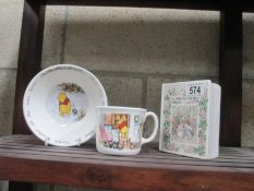 A Royal Doulton Winnie The Pooh cup and bowl and Royal Doulton Brambly Hedge money box