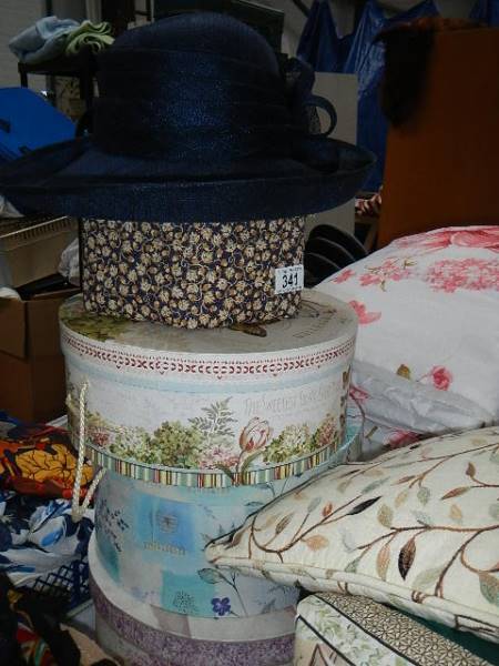 A quantity of hats and hat boxes.