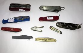 Eleven assorted pen knives including Swiss Army Knife, British Empire Exhibition knife etc.