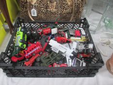 A box of diecast cars etc.