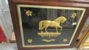 A framed and glazed gilded study of a horse, 72 x 63 cm.