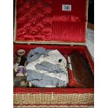 A box of needlework items.