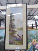 A framed and glazed watercolour - cattle in lake with mountains in background,