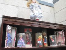 A mixed lot of old dolls some in national costume