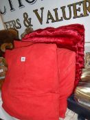 A quantity of red cushions.