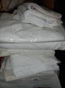 A quantity of white bedlinen etc.