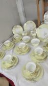 A quantity of Aynsley teaware comprising 2 sandwich plates, 11 tea plates, 8 tea cups, 12 saucers,