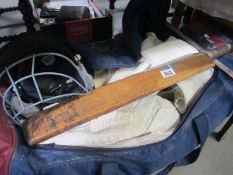 A Slazenger cricket bat, whites and pads etc.