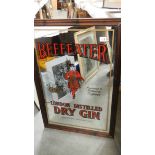 A large Beefeater Gin advertising mirror. 64 c 96 cm (collect only).