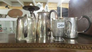 2 silver plate teapots, a coffee pot and a mug.