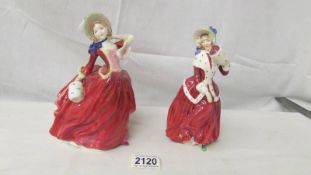 2 Royal Doulton figurines - Christmas Morn HN1992 and Autumn Breezes HN1939.