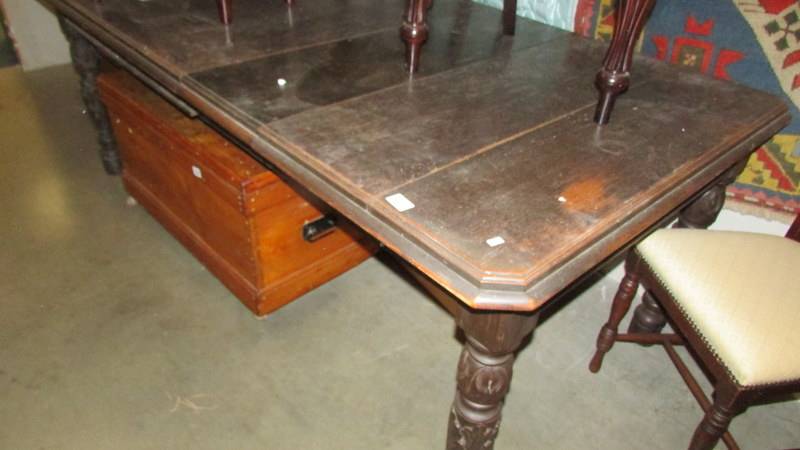 A mahogany extending dining table.