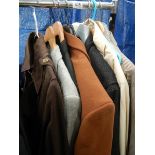 A mixed lot of high end designer jackets and suits, brands include Yves Saint Laurent, Burberry,