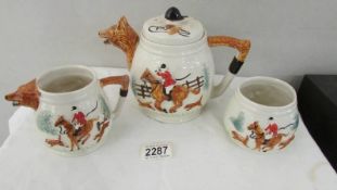 A three piece fox hunting tea set.