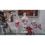 A mixed lot of continental crystal ruby glass overlaid bells, baskets etc.