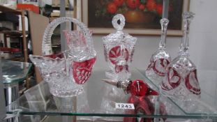A mixed lot of continental crystal ruby glass overlaid bells, baskets etc.