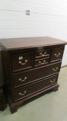 A mahogany chest of drawers.