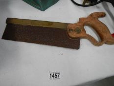 An old brass edged hand saw - Henry Disston & Son,