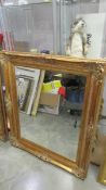 A gilt framed bevel edged mirror, 95 x 80 cm.