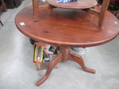 A dark pine round kitchen table Diameter 90cm,