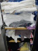 4 shelves of cardigans, linen etc.