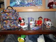 A collection of Disney items including back pack, beanies,