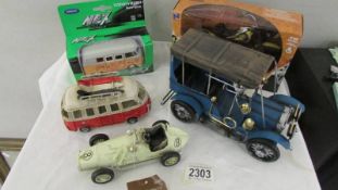 A boxed 'Indian Chief' motor cycle, 2 VW camper vans and 2 other model cars.