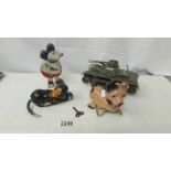 A tin plate tank, a tin plate clockwork cat (iwo), a clockwork dog (iwo) and wooden Mickey Mouse.